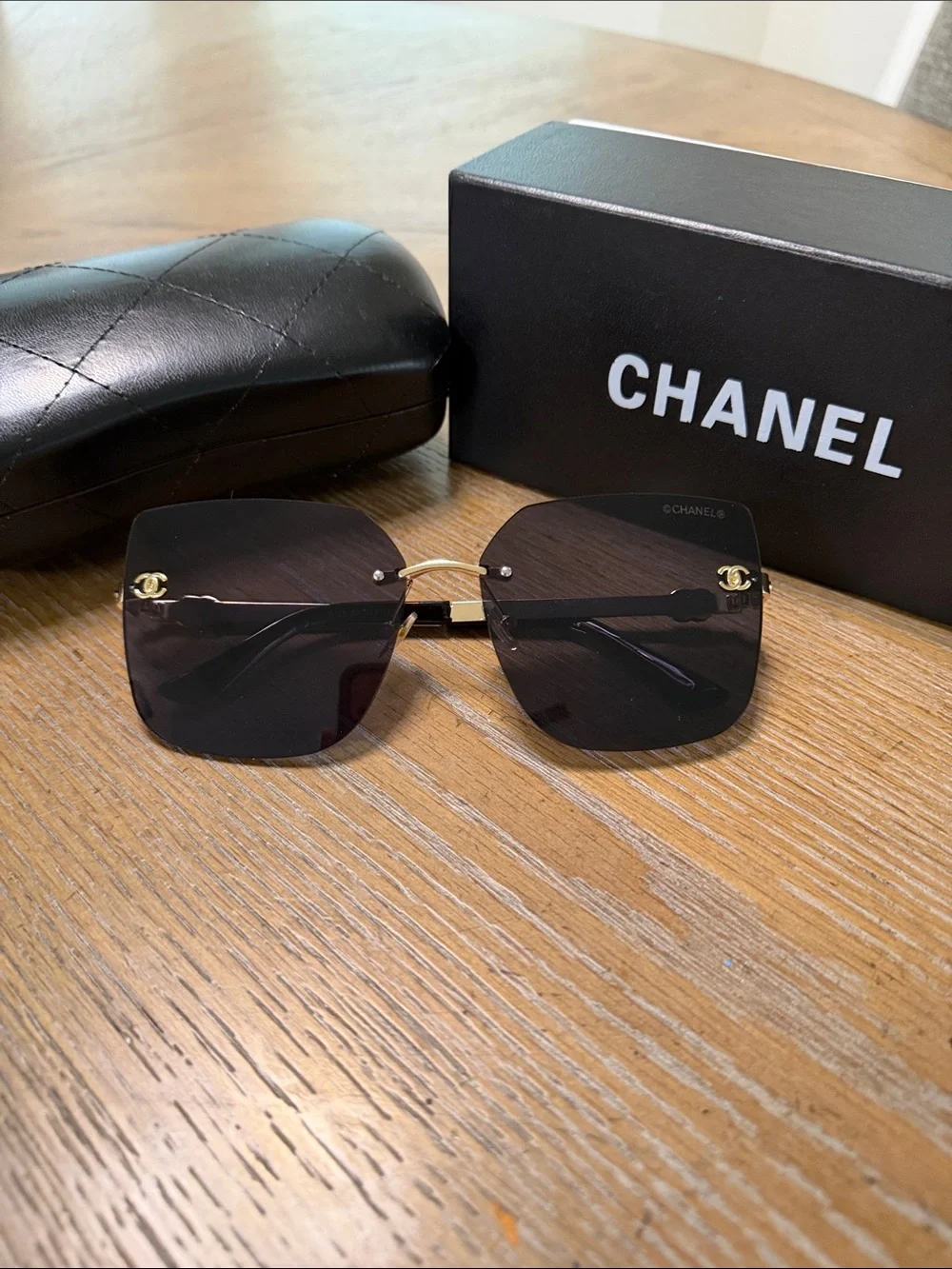 CHANEL Rimless Square Sunglasses with Dark Gradient Lenses and Gold Accents